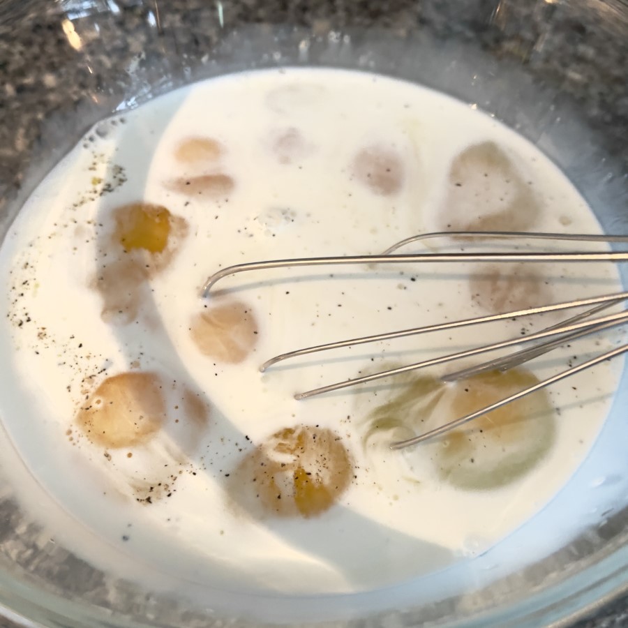 Mixing eggs and 2% milk for Spinach & Feta Egg Bites