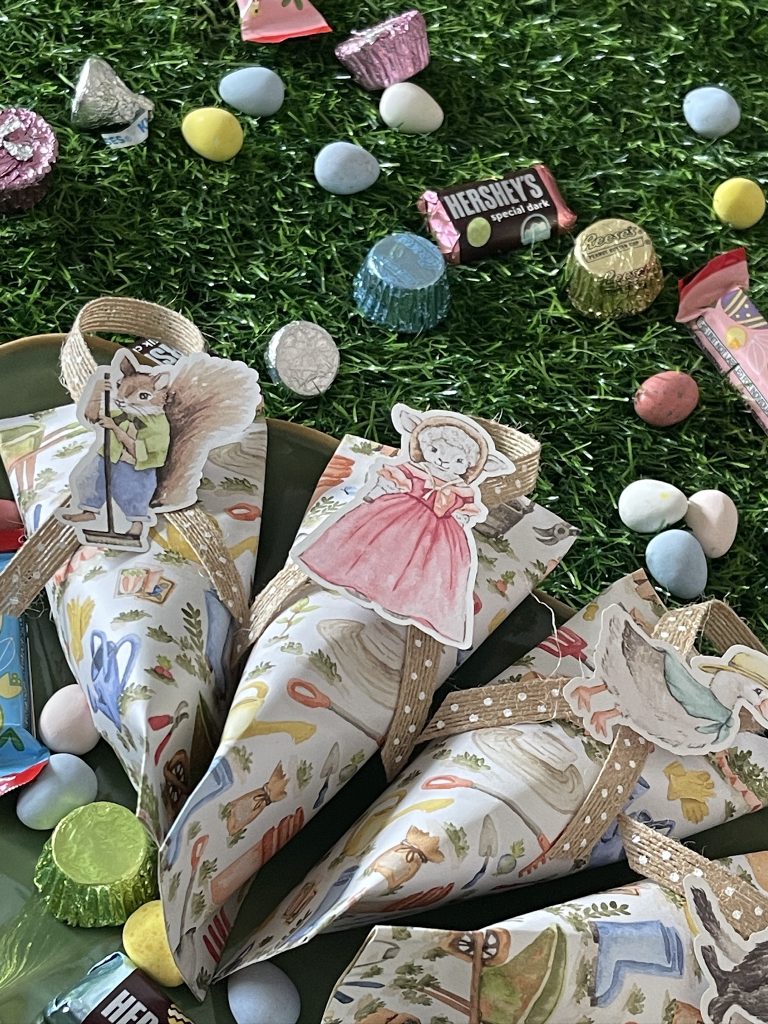 DIY Paper Easter Favors with pastel colors and colorful candies.