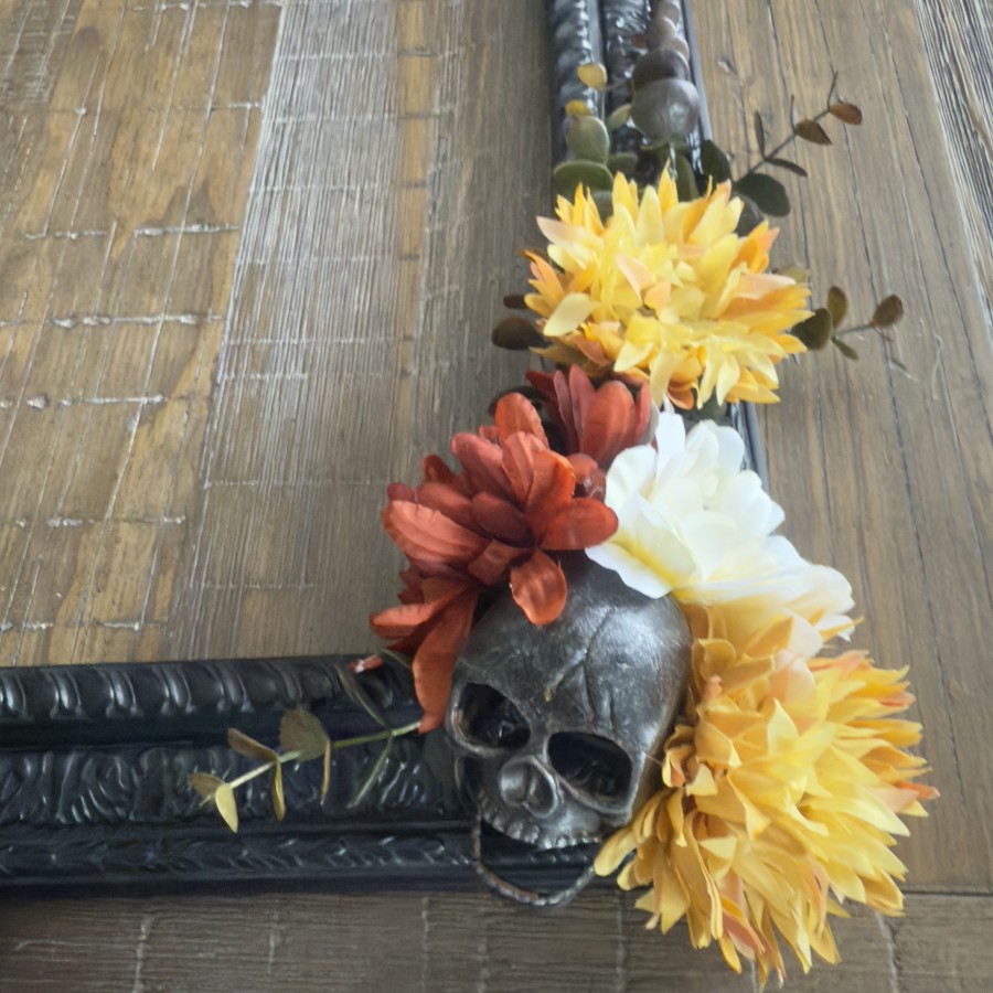 Unique fall wreath with metal skull with beautiful fall florals.